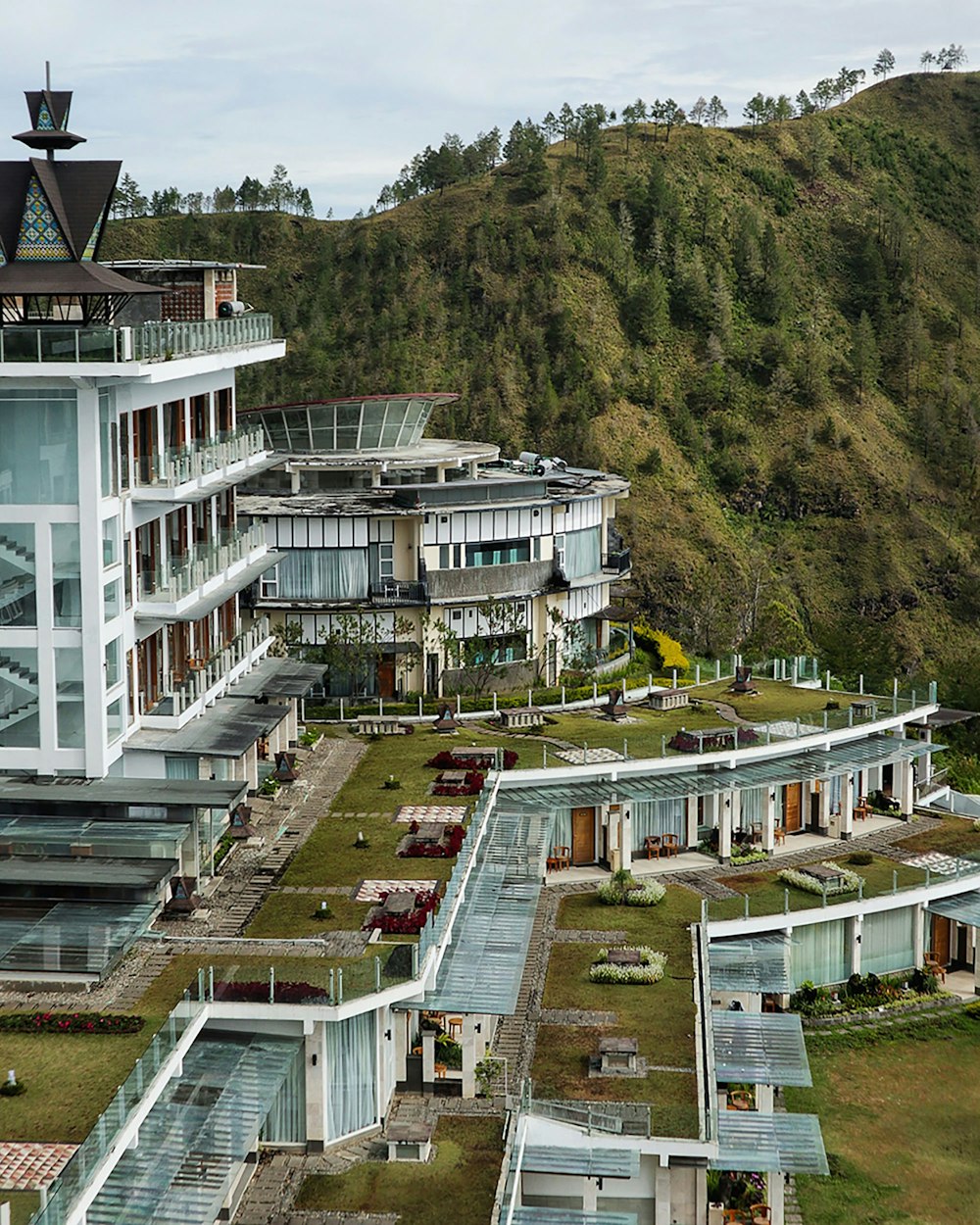 an aerial view of a building with a green roof