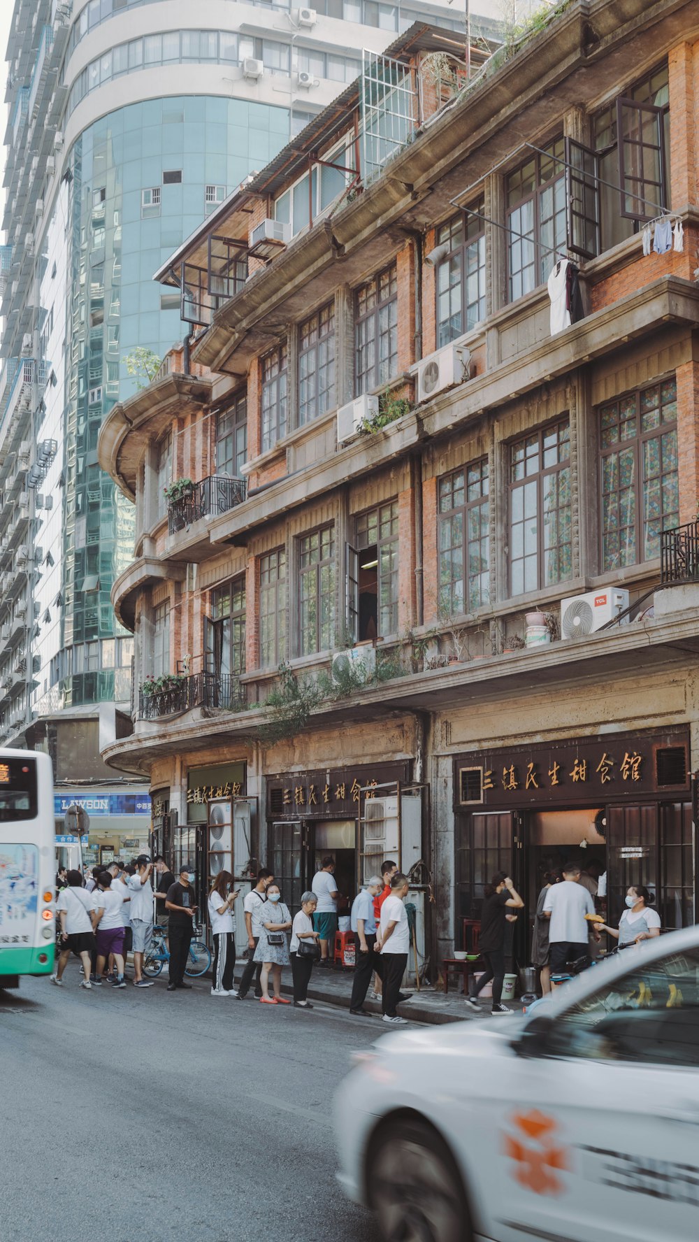 a group of people standing outside of a building