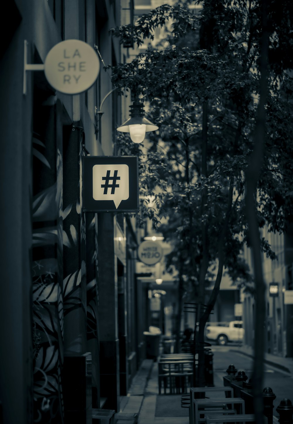 a black and white photo of a street sign