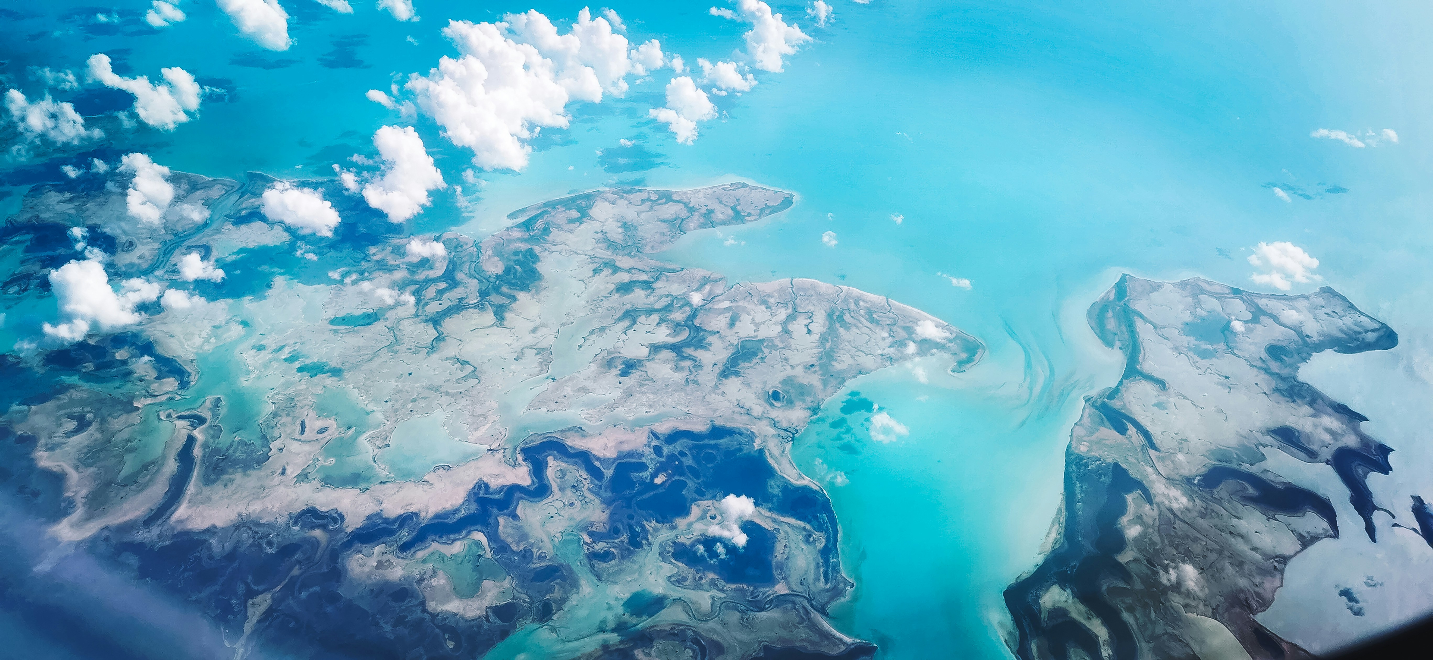 a view of the ocean from an airplane
