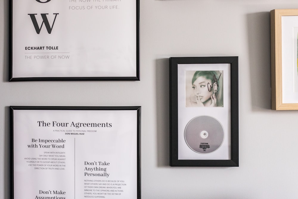 a group of framed photographs on a wall