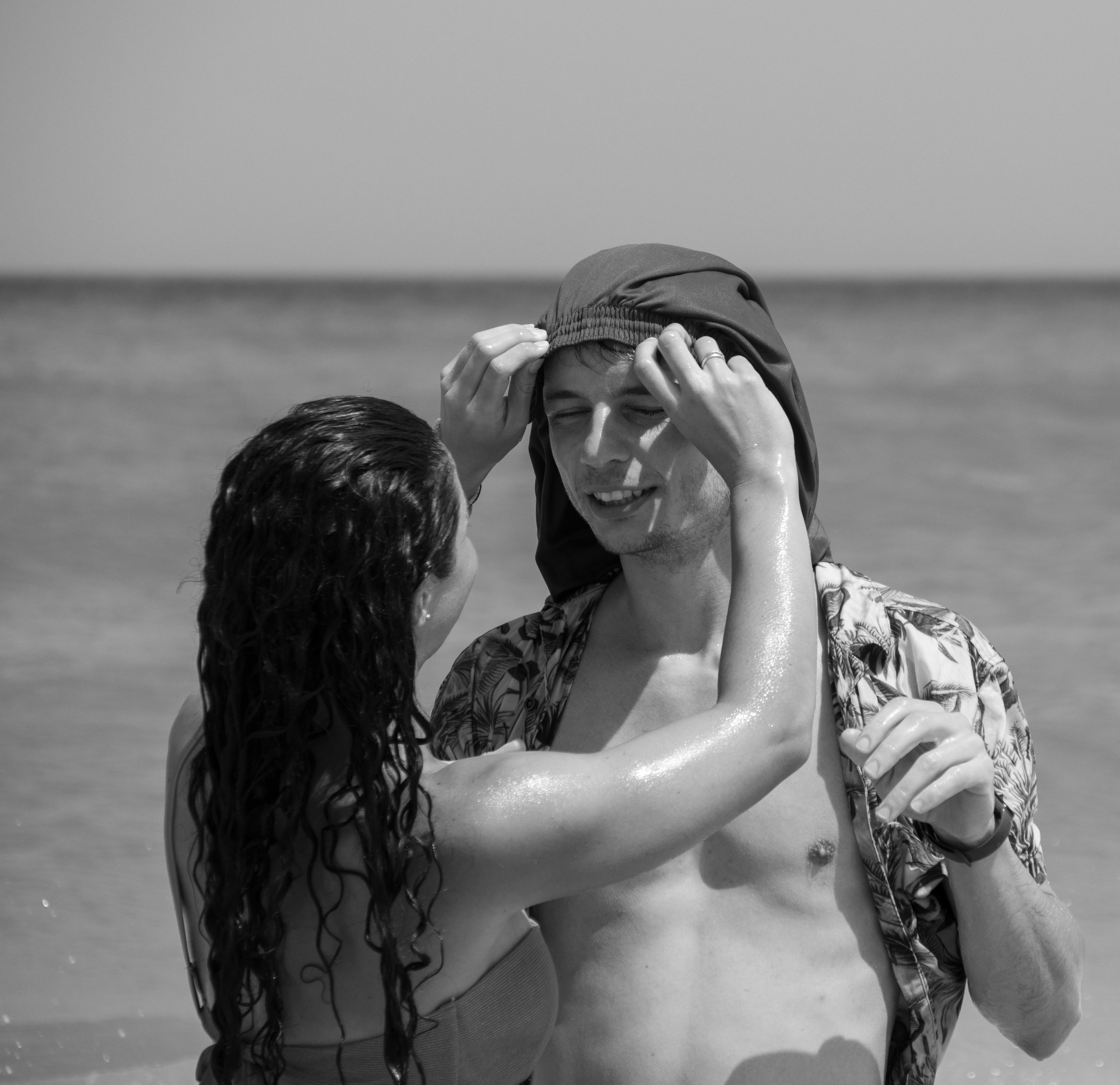 a couple of people that are standing in the water
