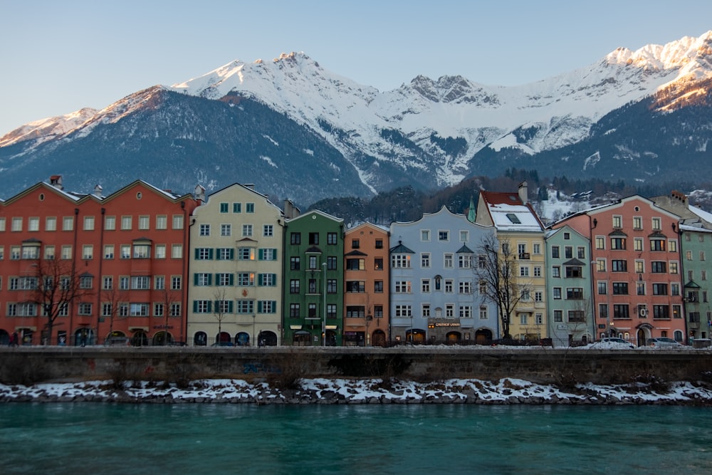 a group of buildings next to a body of water