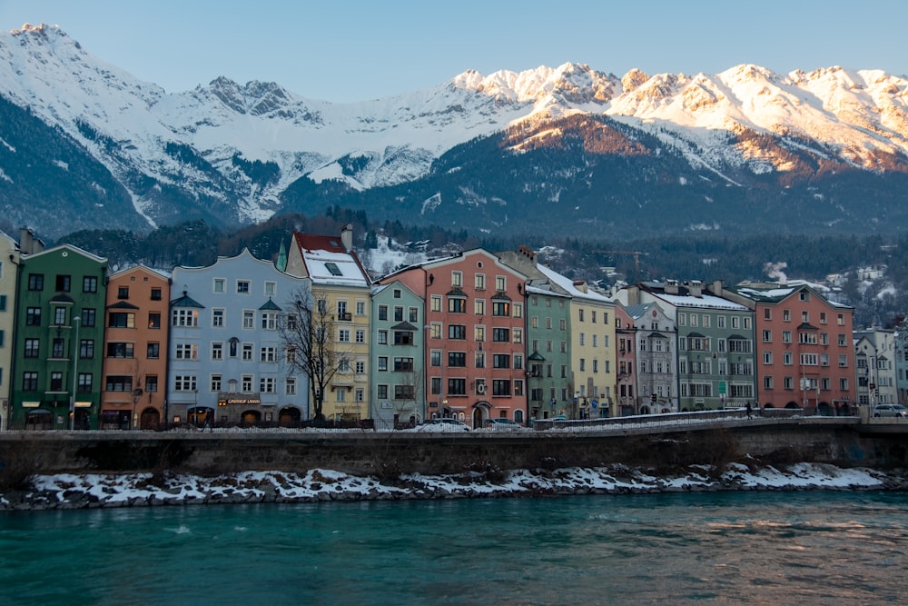 a group of buildings next to a body of water