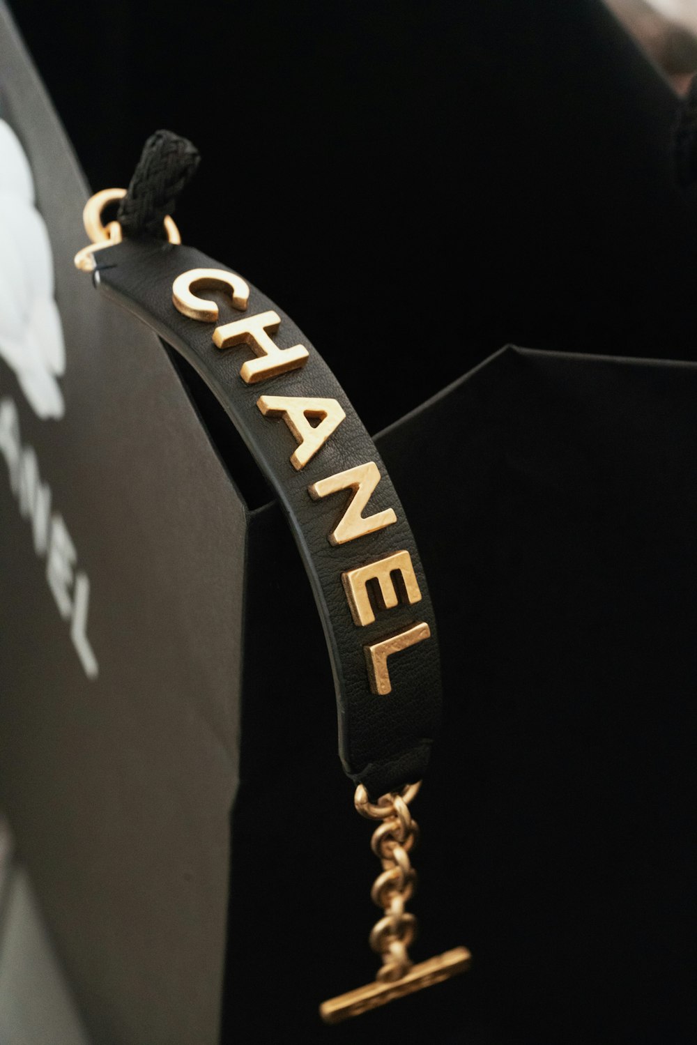 a black box with a gold chanel logo on it