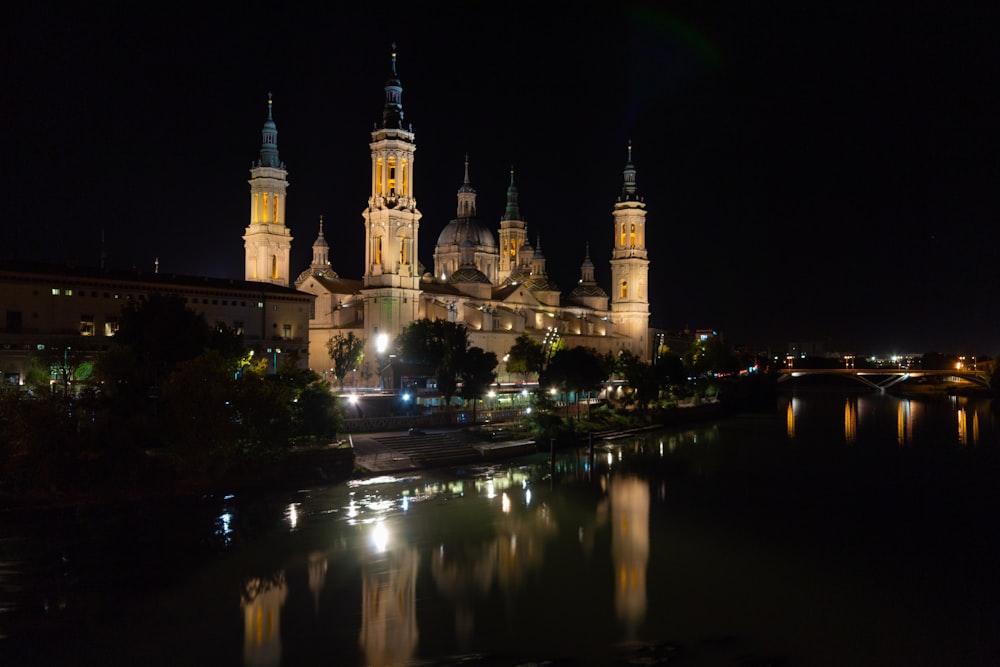 a night view of a city with a river running through it