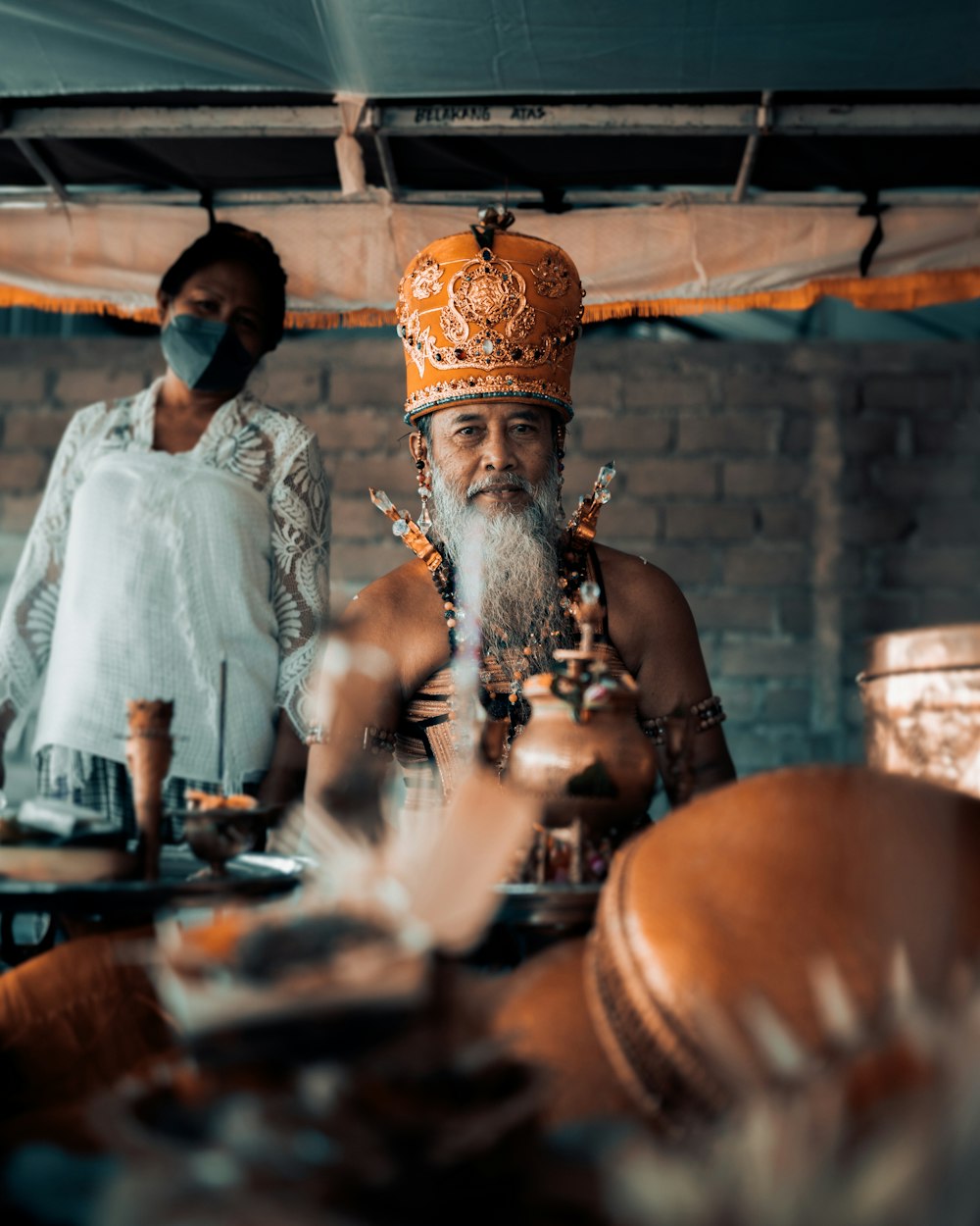 a man with a beard wearing a crown