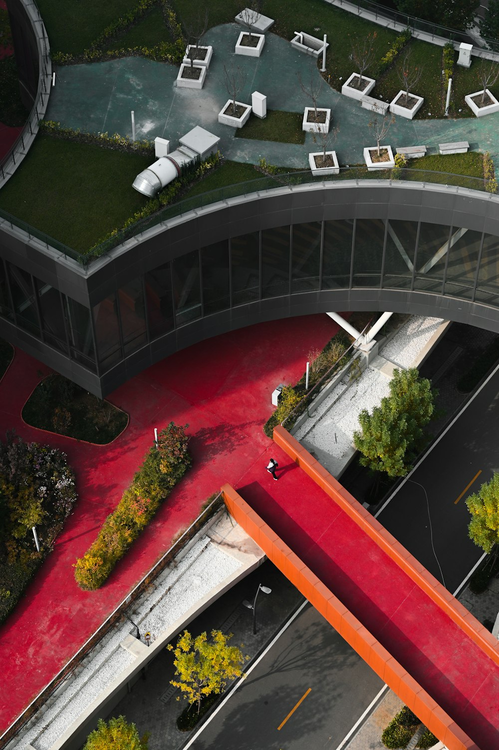 an aerial view of a building with a green roof