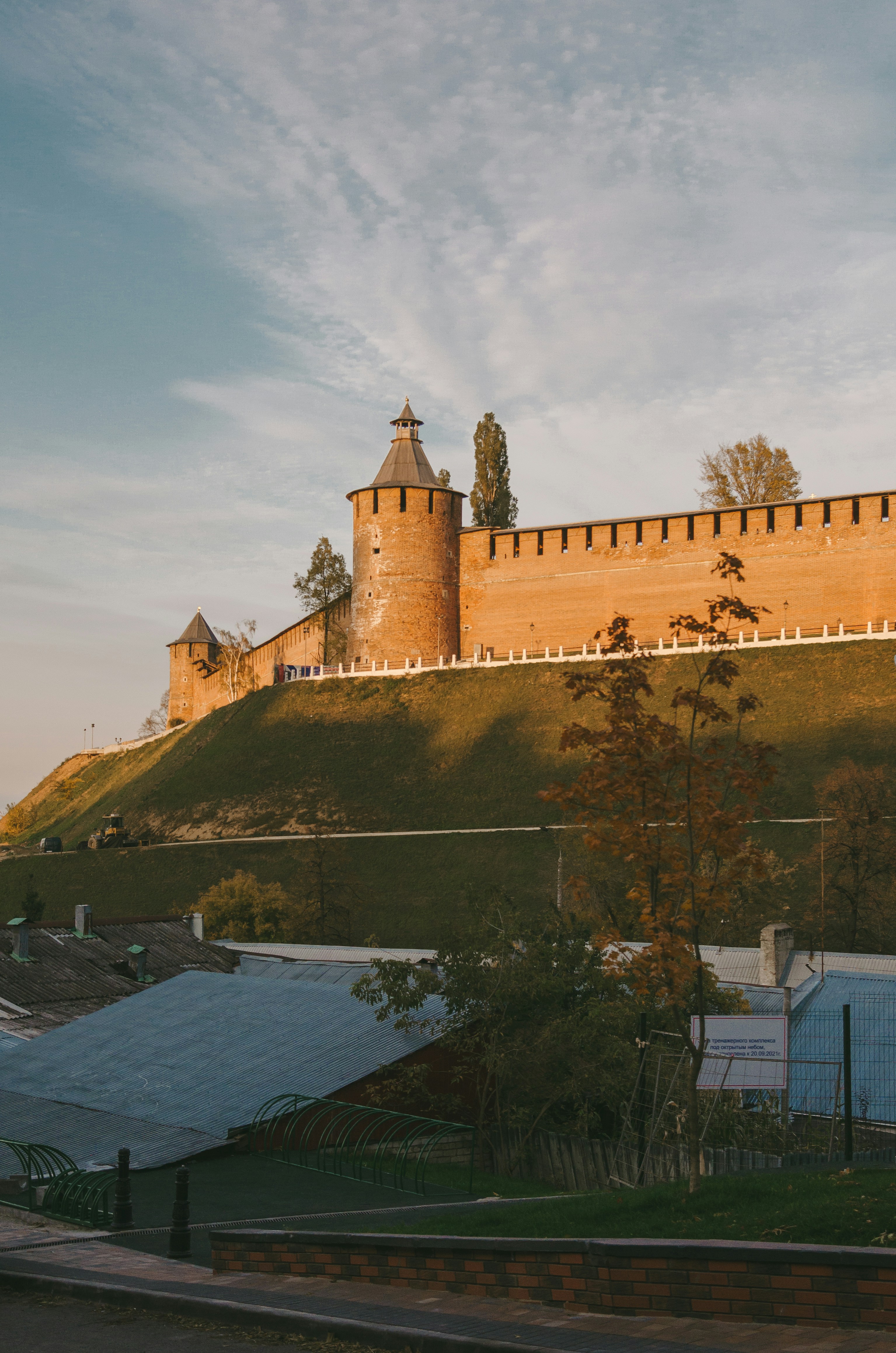a castle on top of a hill with a sky background