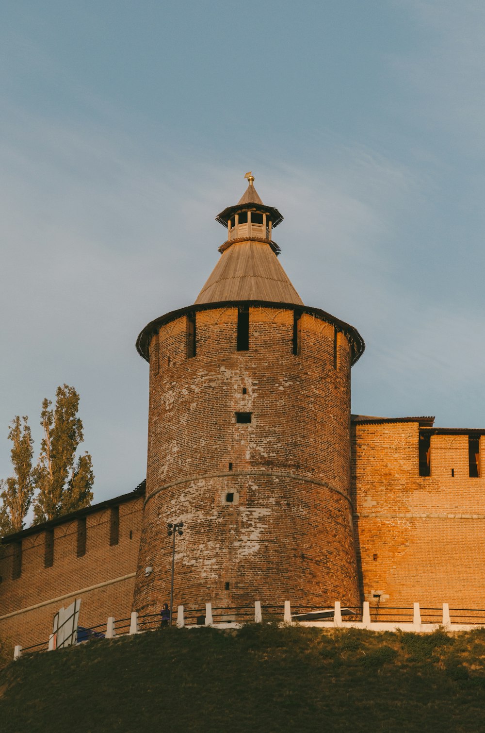 a tall brick tower with a clock on top of it