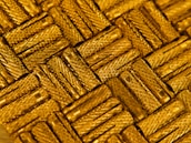 Close-up of shiny metallic gold architectural hardware pieces displayed elegantly.