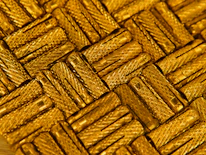 Close-up of metallic gold and olive green architectural details highlighting premium materials.