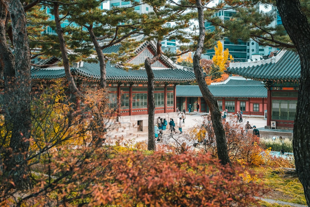 a group of people walking around a building