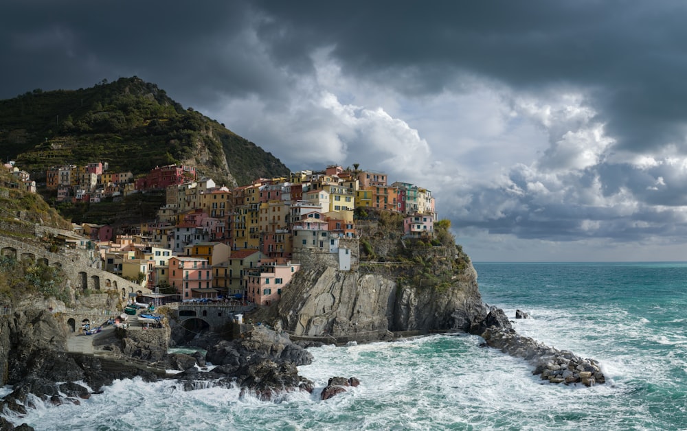 a village on a cliff above the ocean