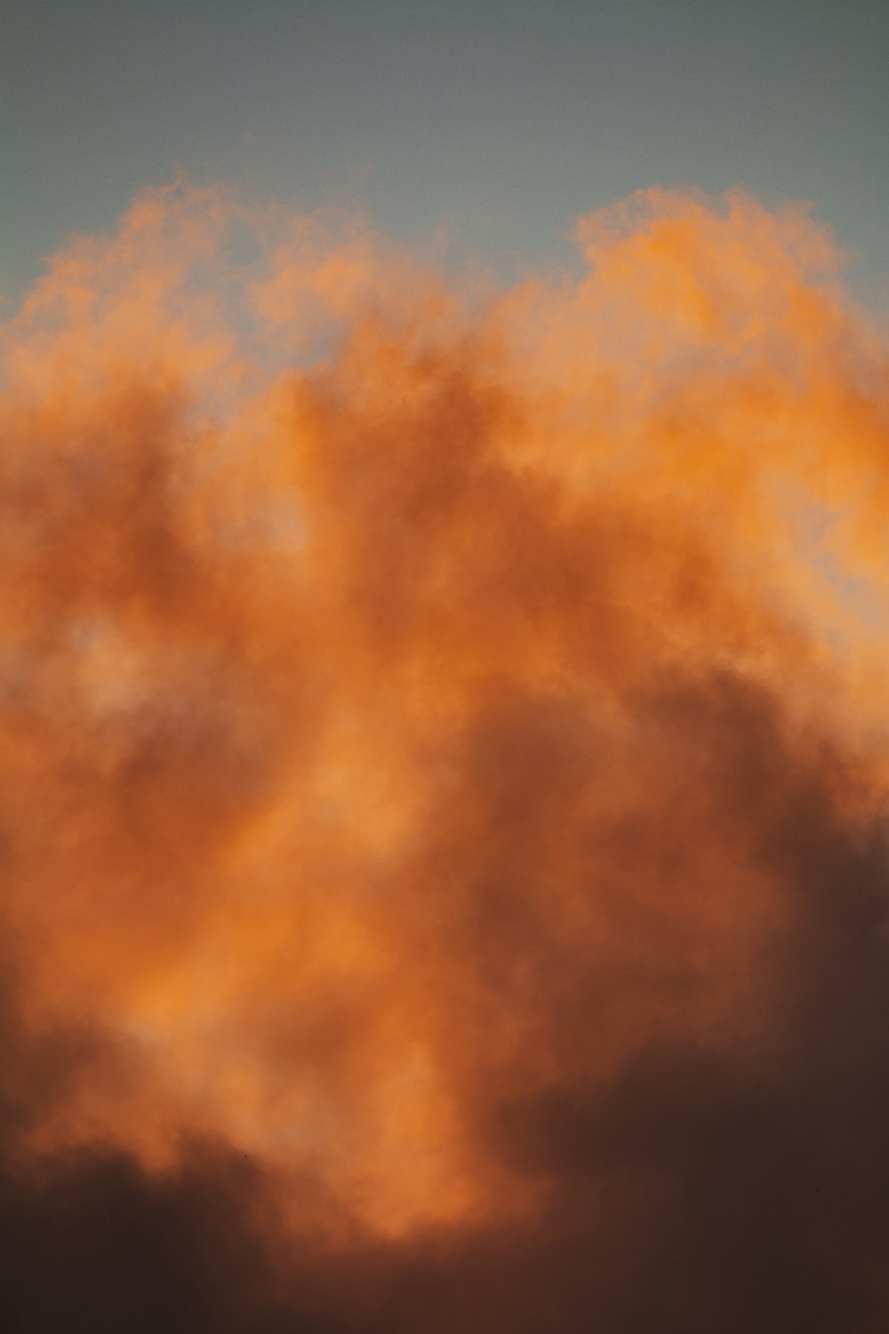 a plane flying in the sky with a lot of clouds