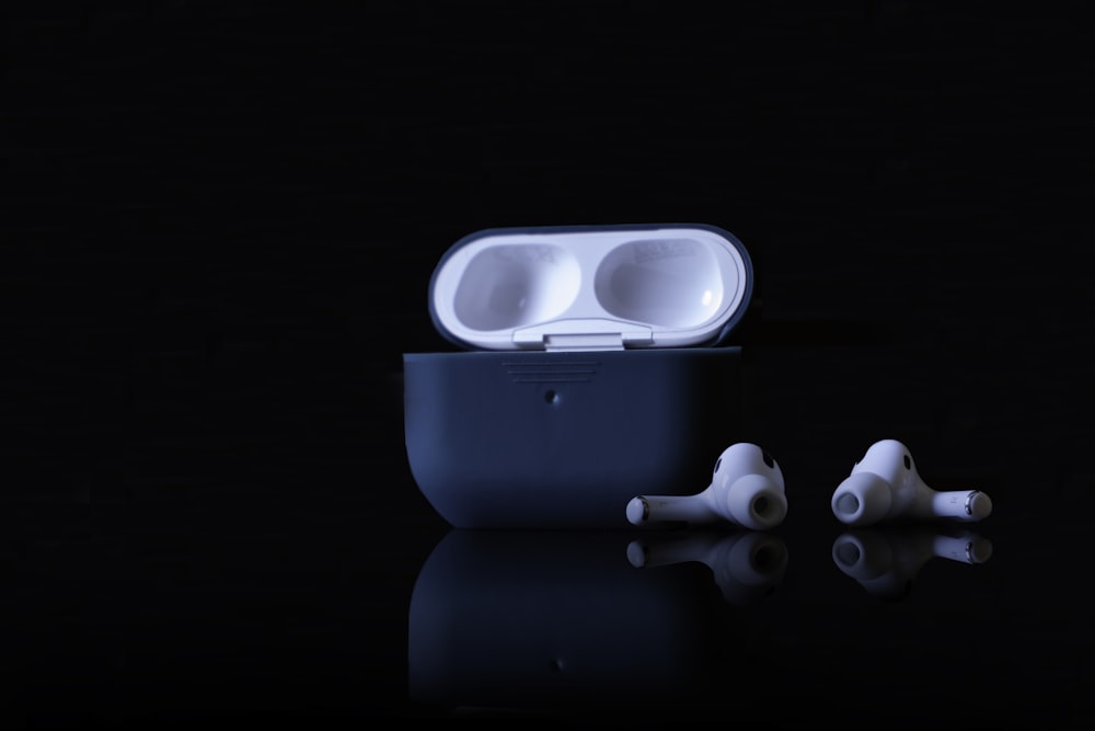 a pair of ear buds sitting on top of a table