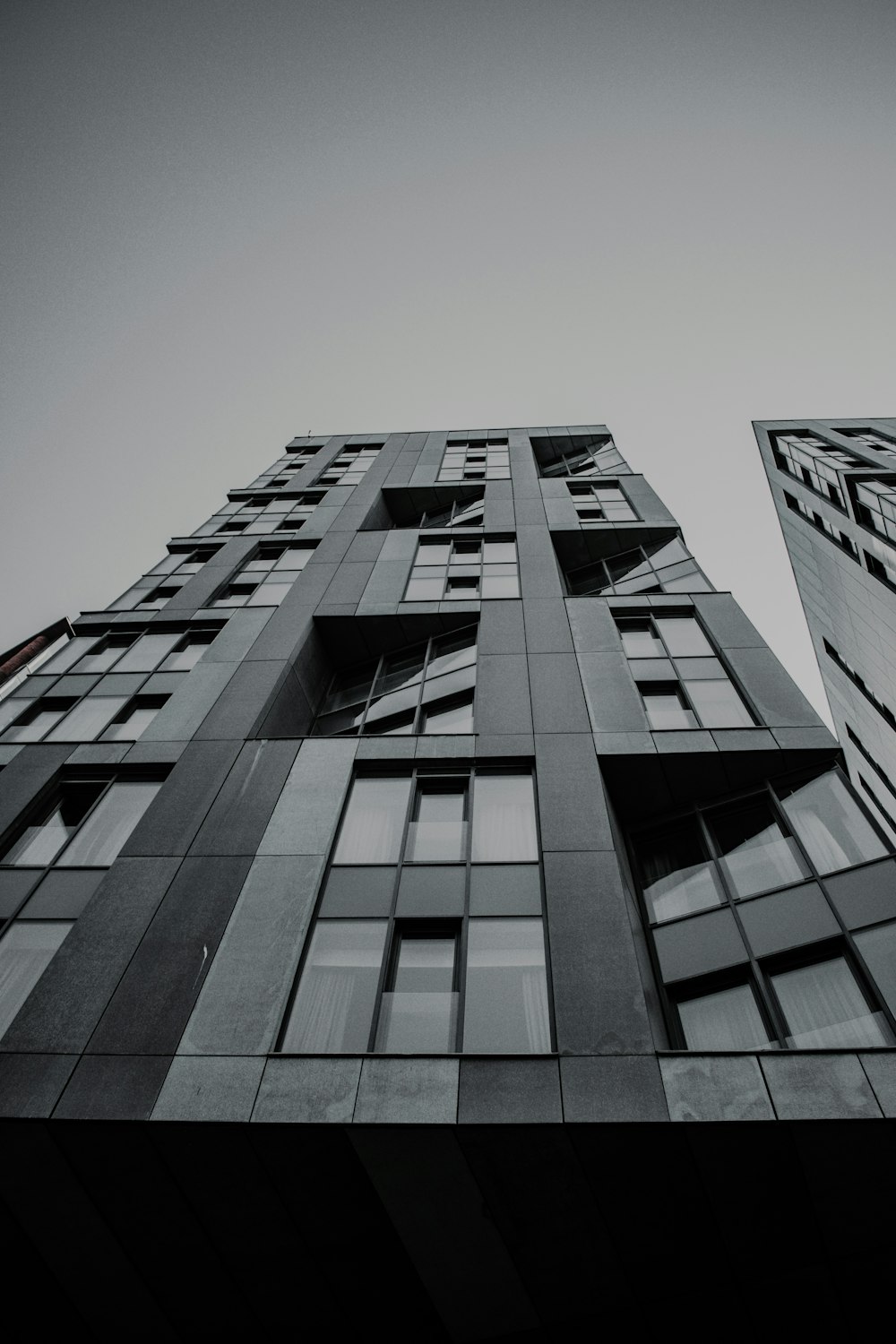 a black and white photo of a tall building