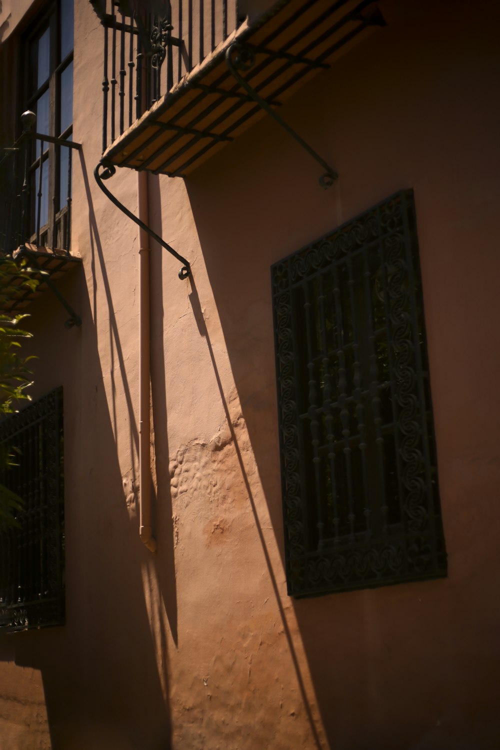 the shadow of a building on a street