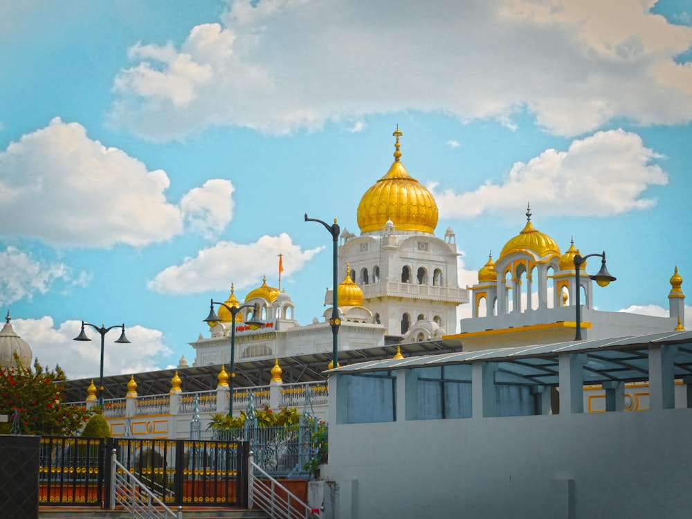 a painting of a yellow and white building