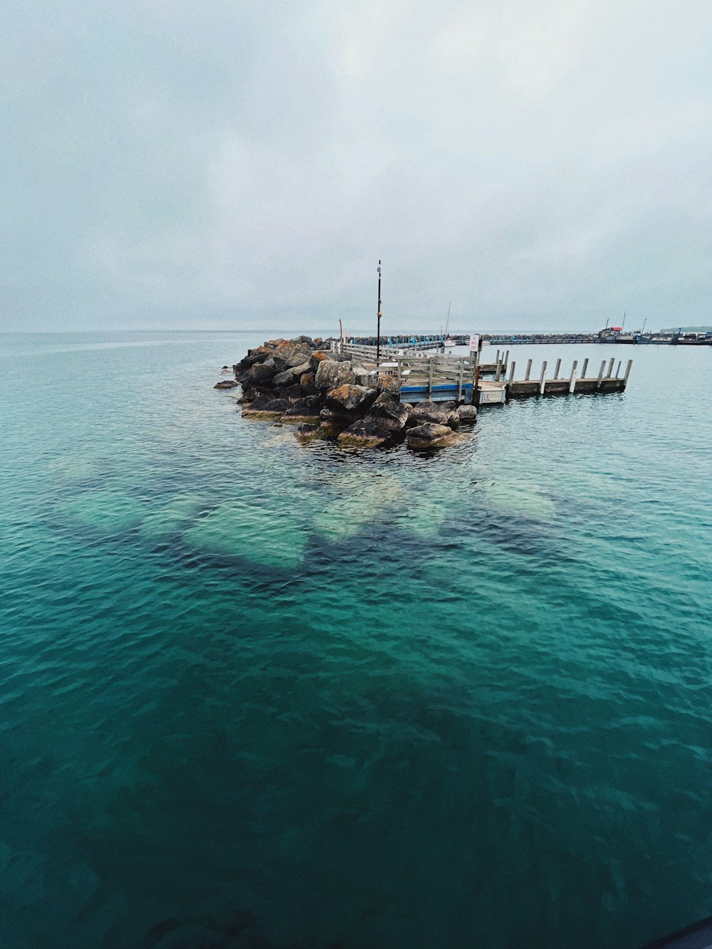 a boat sitting on top of a large body of water