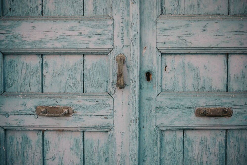 a close up of a wooden door with a handle