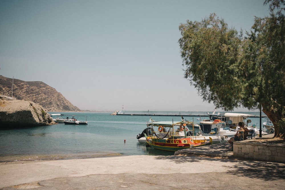 a group of boats that are sitting in the water