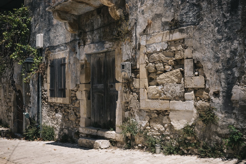 a stone building with a door and window
