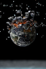 A globe wrapped in chains slowly breaking apart.