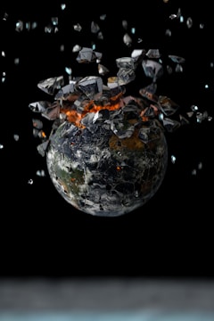 A globe wrapped in chains slowly breaking apart.