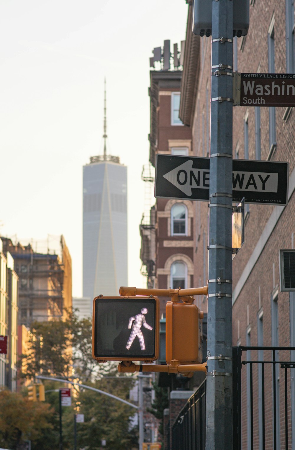 a traffic light on a city street with buildings in the background