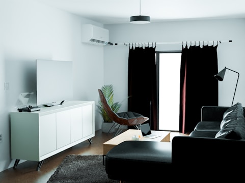 A modern living room with a sleek air conditioner installed.