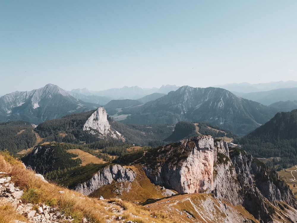 a view of a mountain range with mountains in the background