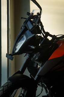 Side view of a Honda motorcycle with a light, airy backdrop.
