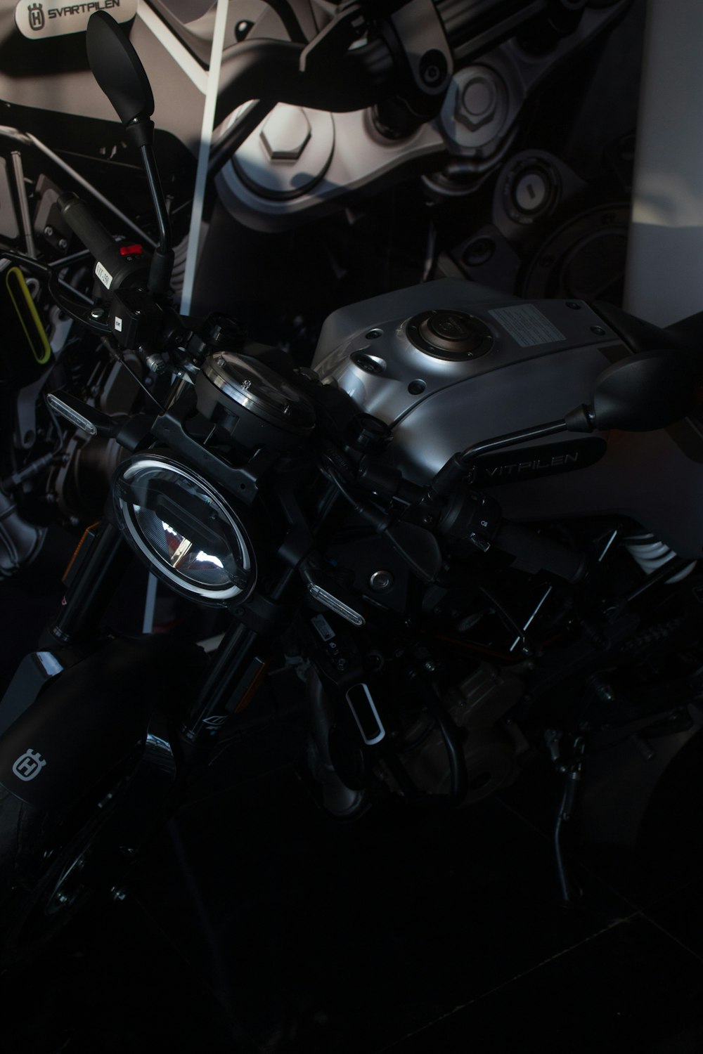 a motorcycle is parked in a dark room