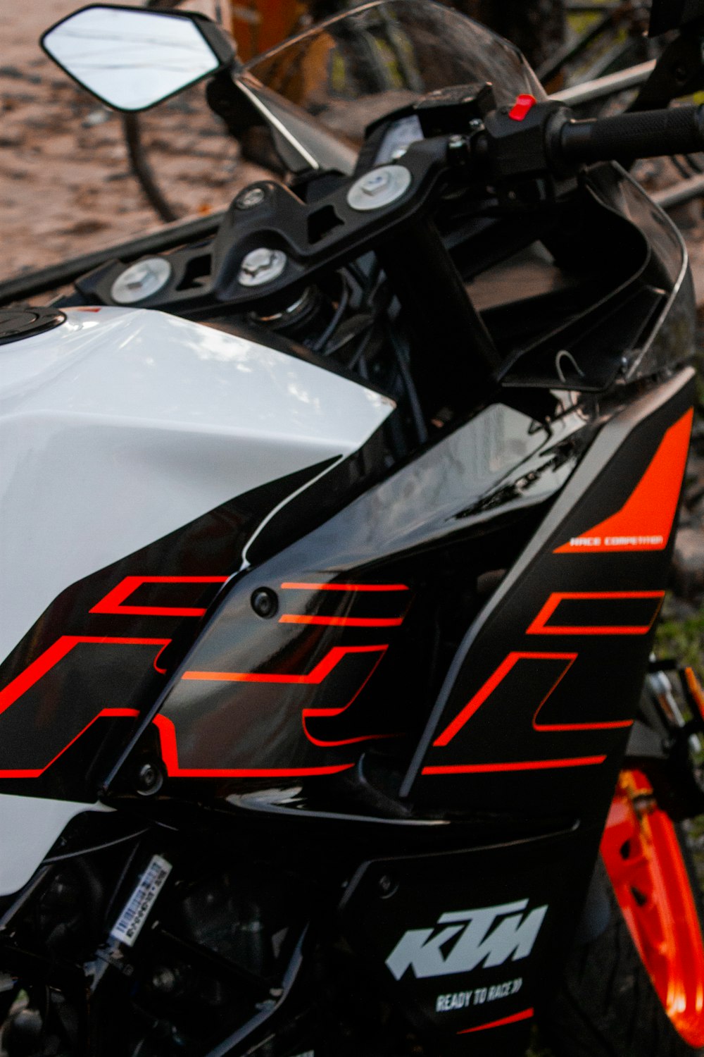 a close up of a motorcycle parked on a street