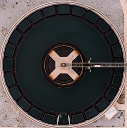 an overhead view of a circular metal structure