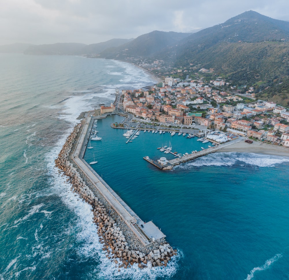 an aerial view of a city and a body of water