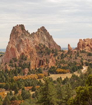 A breathtaking view of San Francisco Peaks rising above the vibrant autumn colors of Oak Creek Canyon.