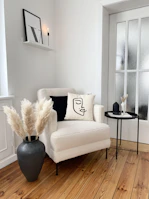 a living room with a white couch and a black table