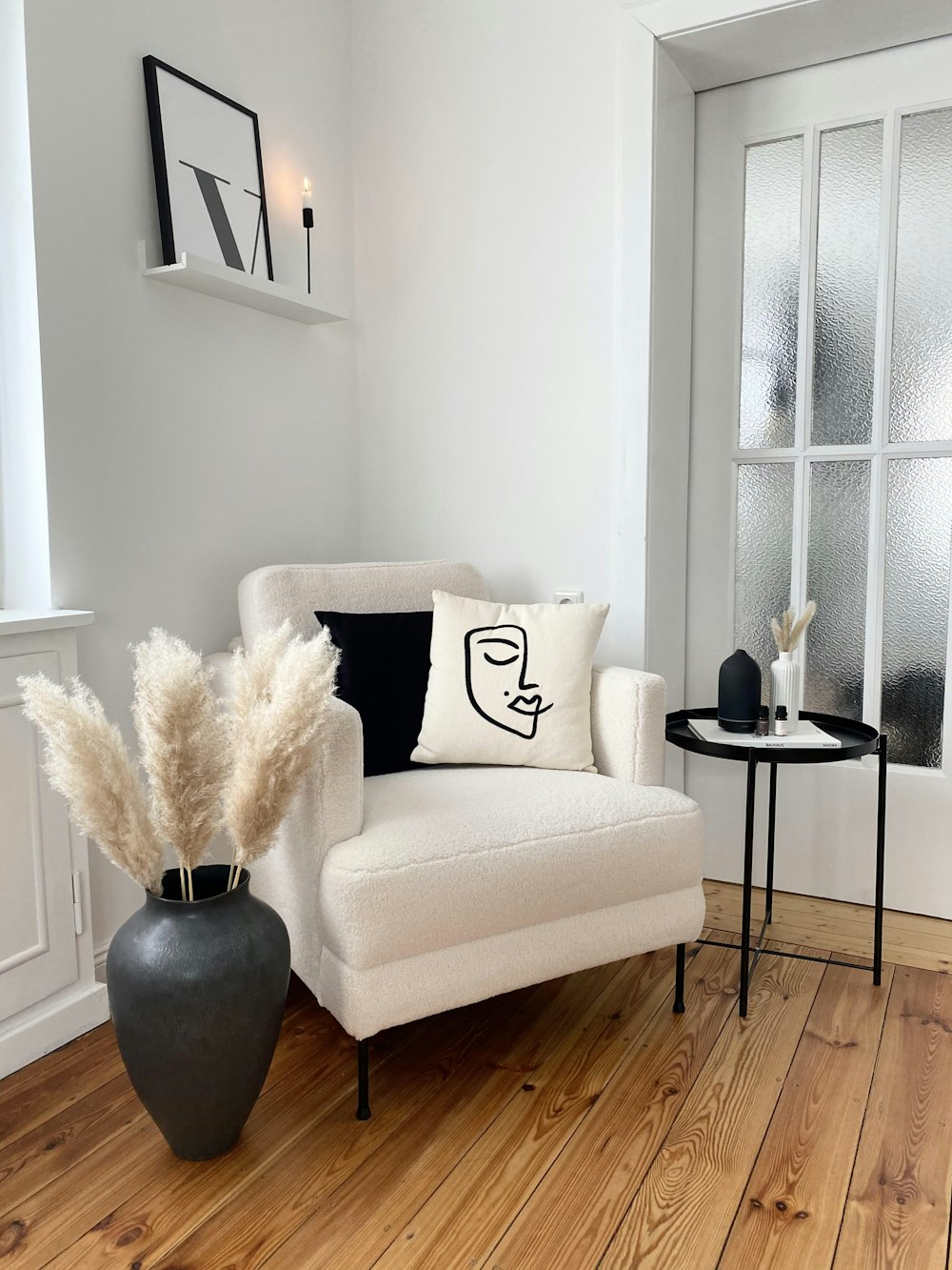 a living room with a white couch and a black table