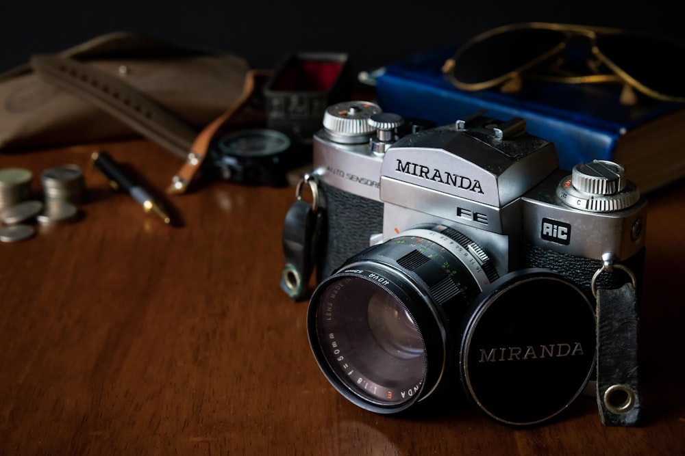 a camera sitting on top of a wooden table