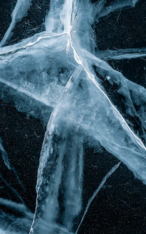 a star made out of ice on a black background