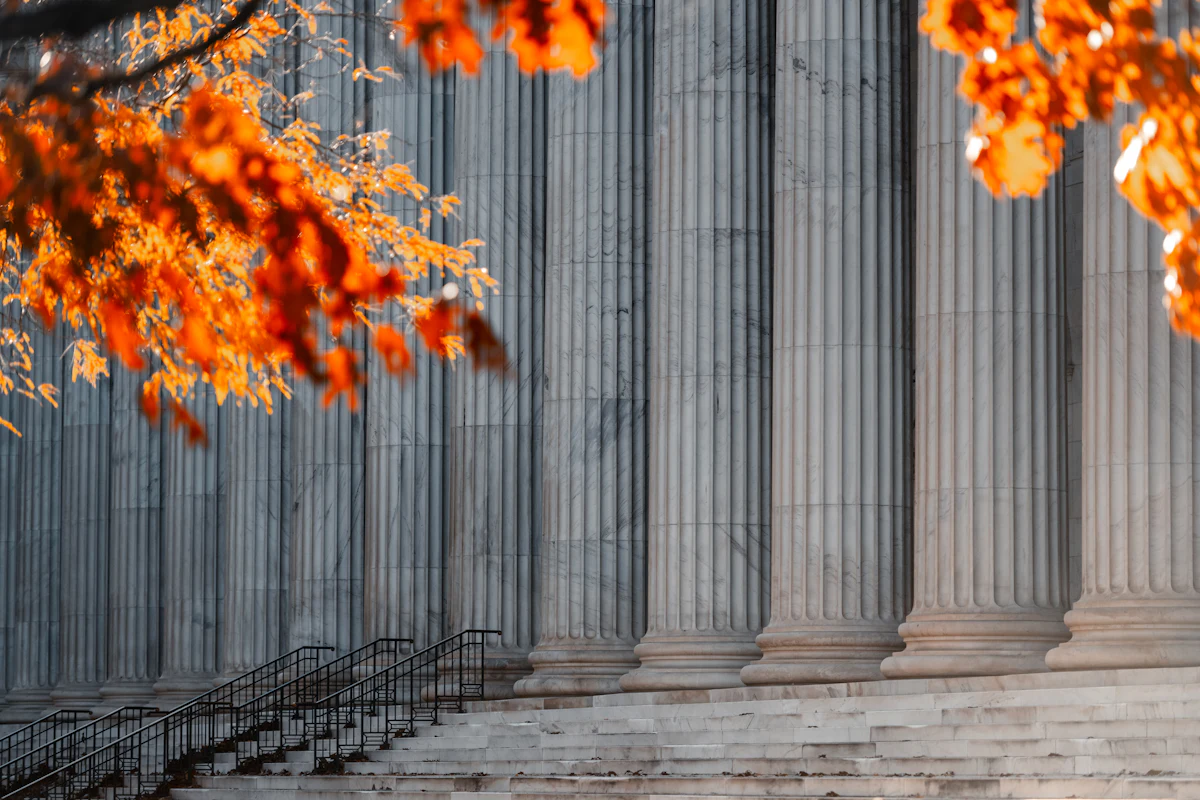 A courthouse exterior with tall columns under a clear sky