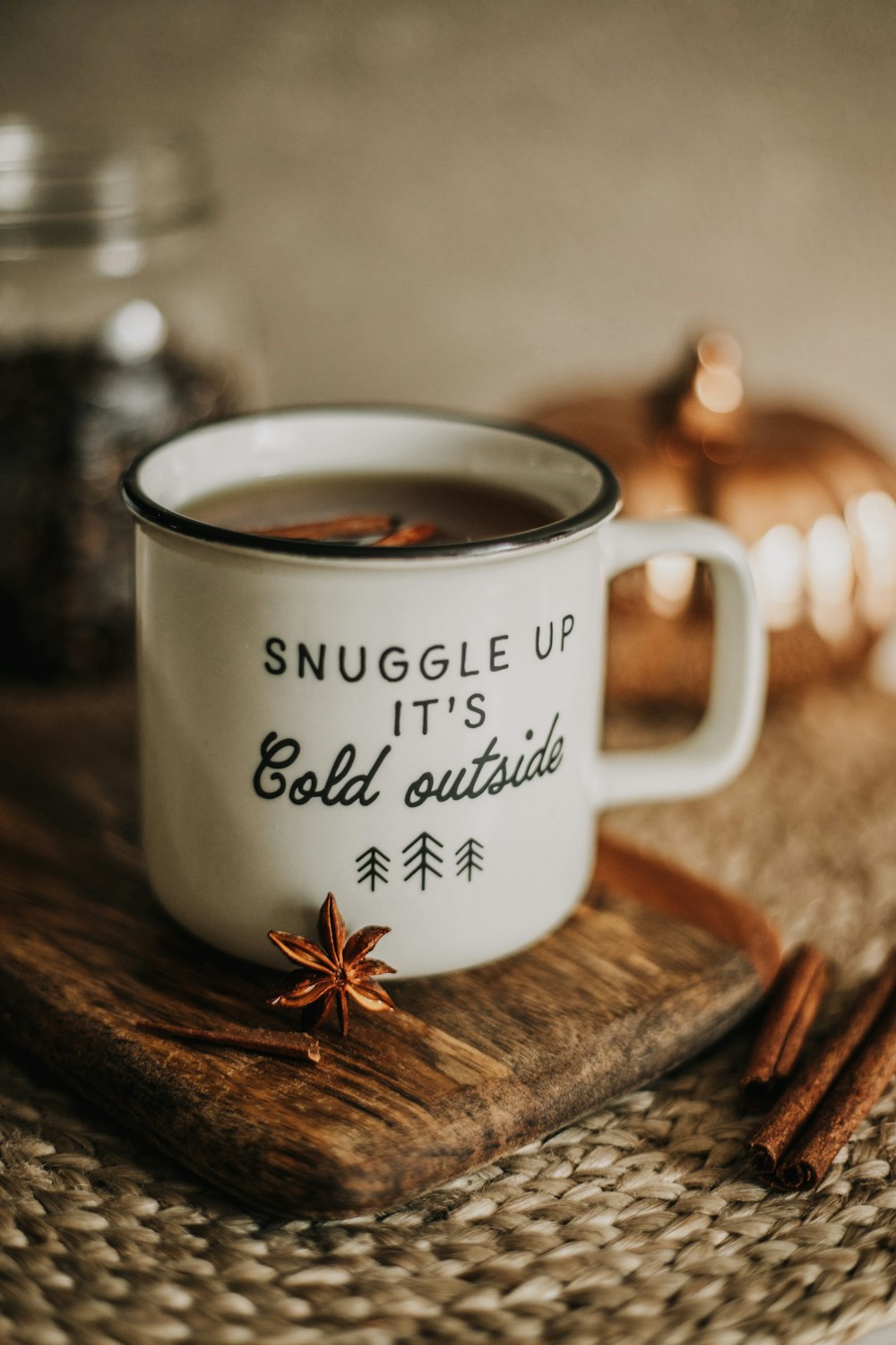 a cup of hot chocolate sits on a cutting board