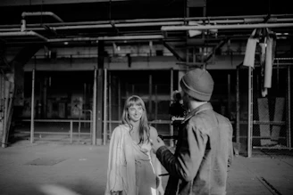 a black and white photo of a man and a woman