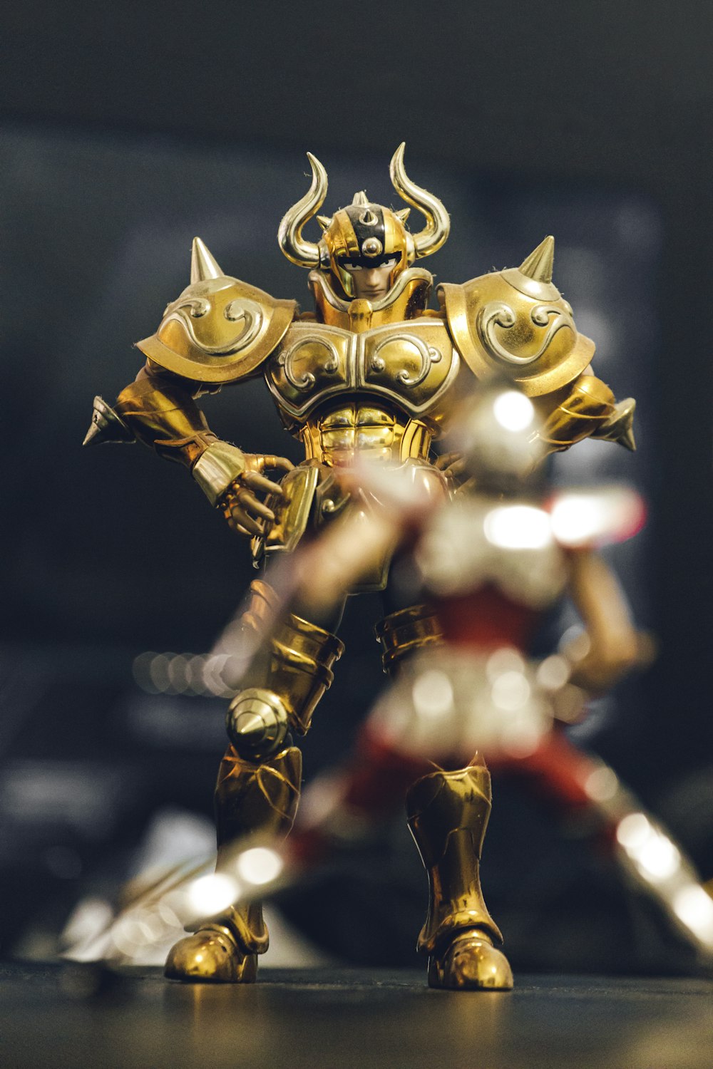 a toy figurine of a man in armor