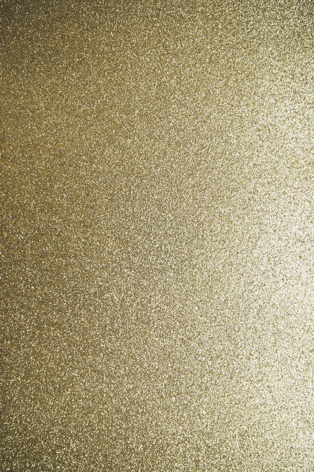 a close up of a gold glitter background