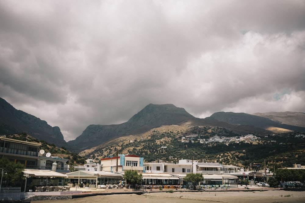 a view of a town with mountains in the background