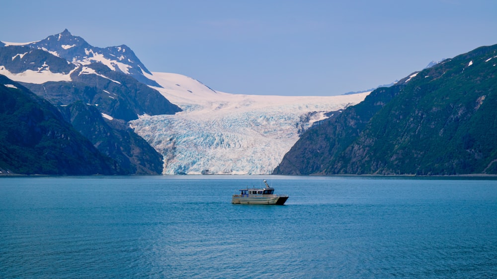 a large body of water with a mountain in the background