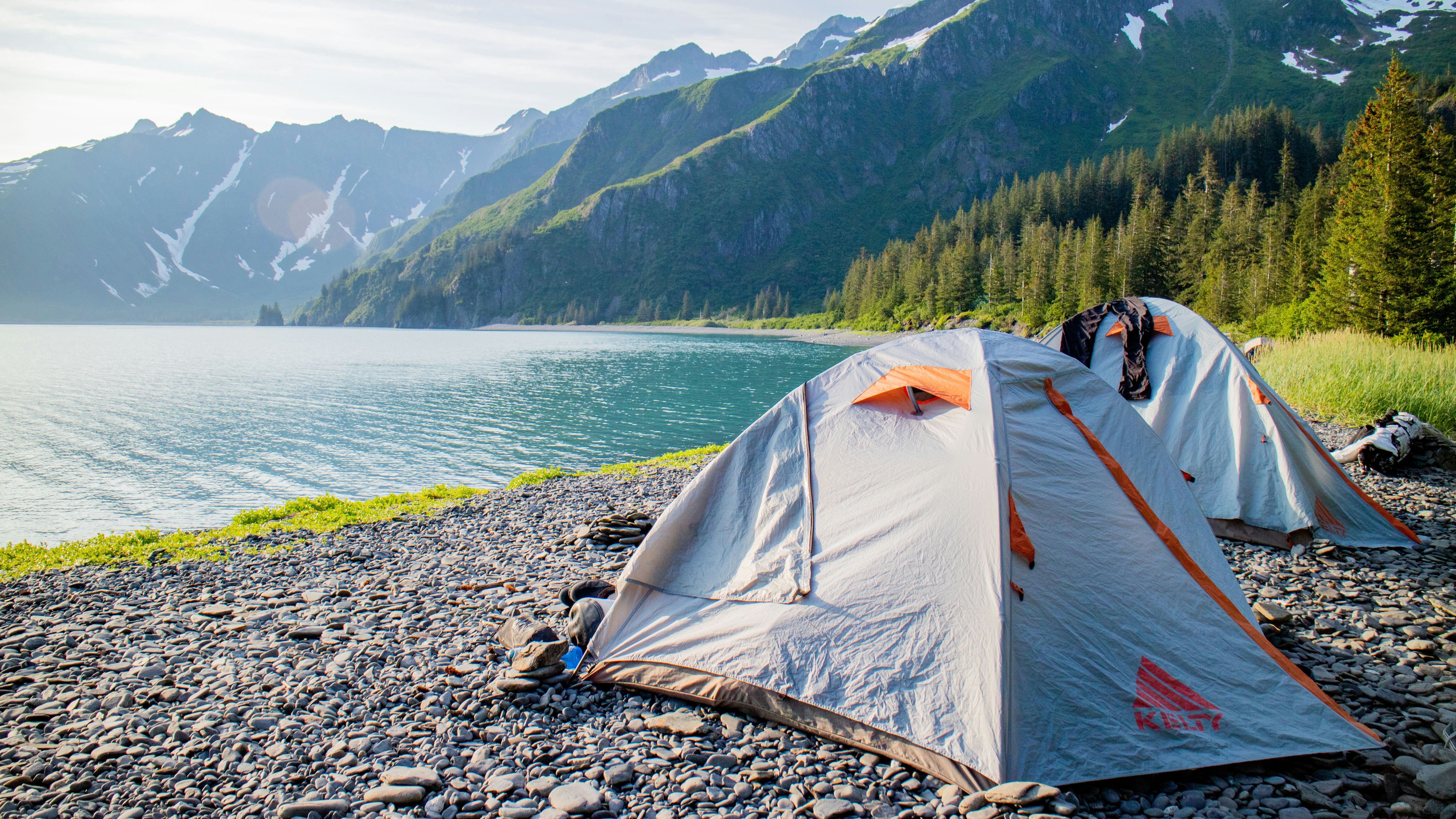 a tent pitched up on the shore of a lake, Camping on Holgate Arm